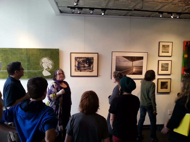 Gallery Director and artist Amy Medford answers questions from middle schoolers during Students @ Work - Art & Culture Day at Artetude Gallery.