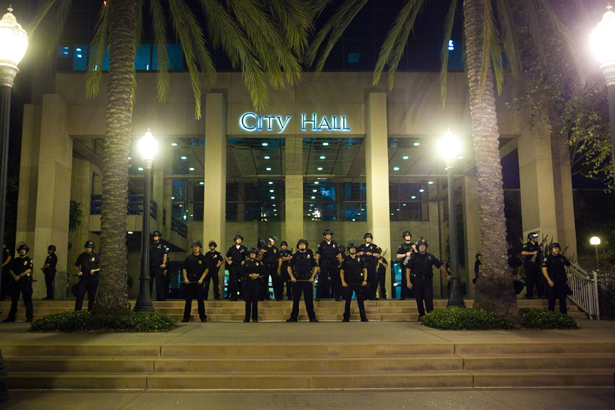  A line of Orange County Police Officers protect Anaheim City Hall. 