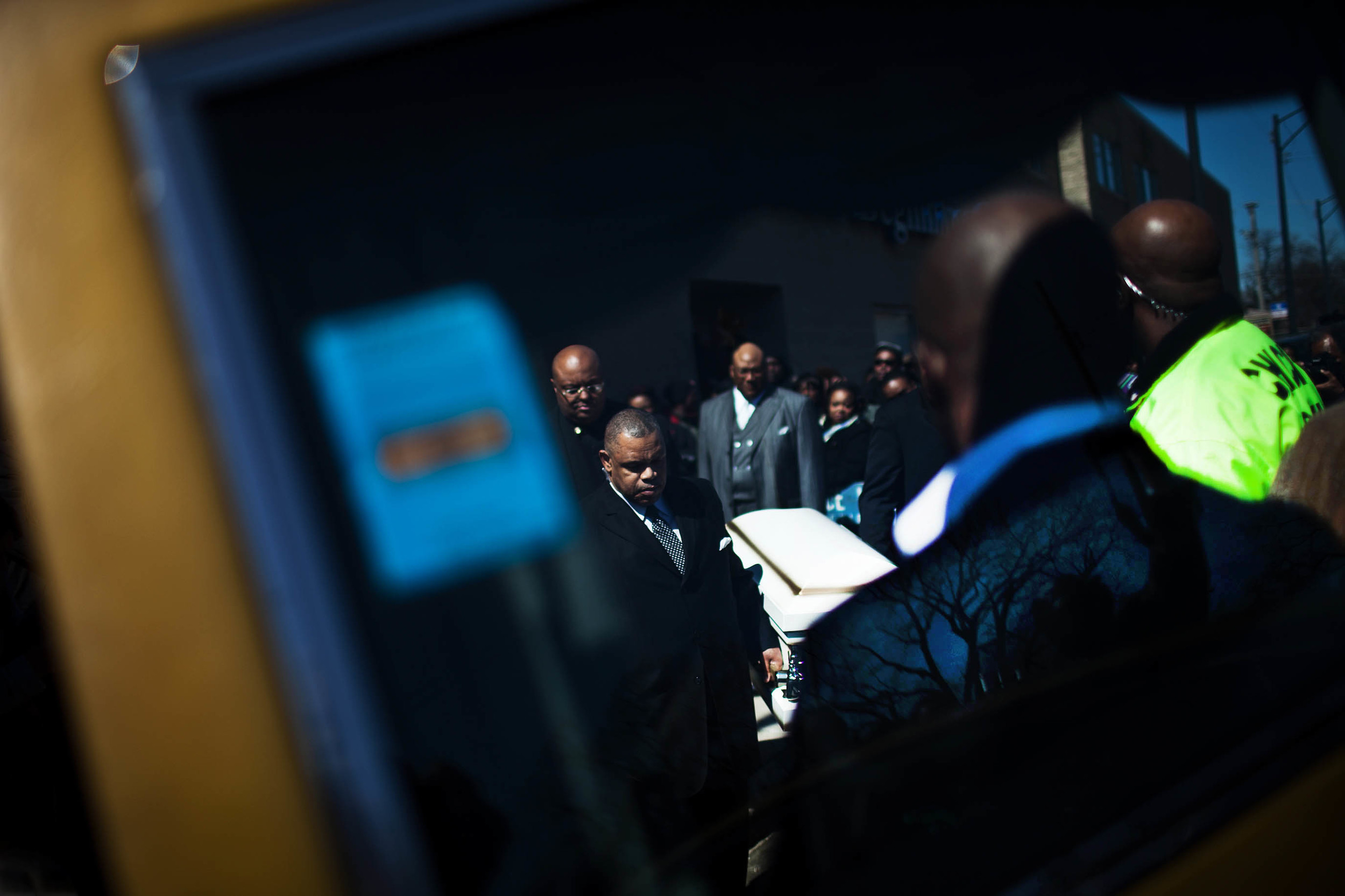   Pallbearers carry the remains of 6-month-old Jonylah Watkins after her funeral service at New Beginnings Church in Woodlawn.  