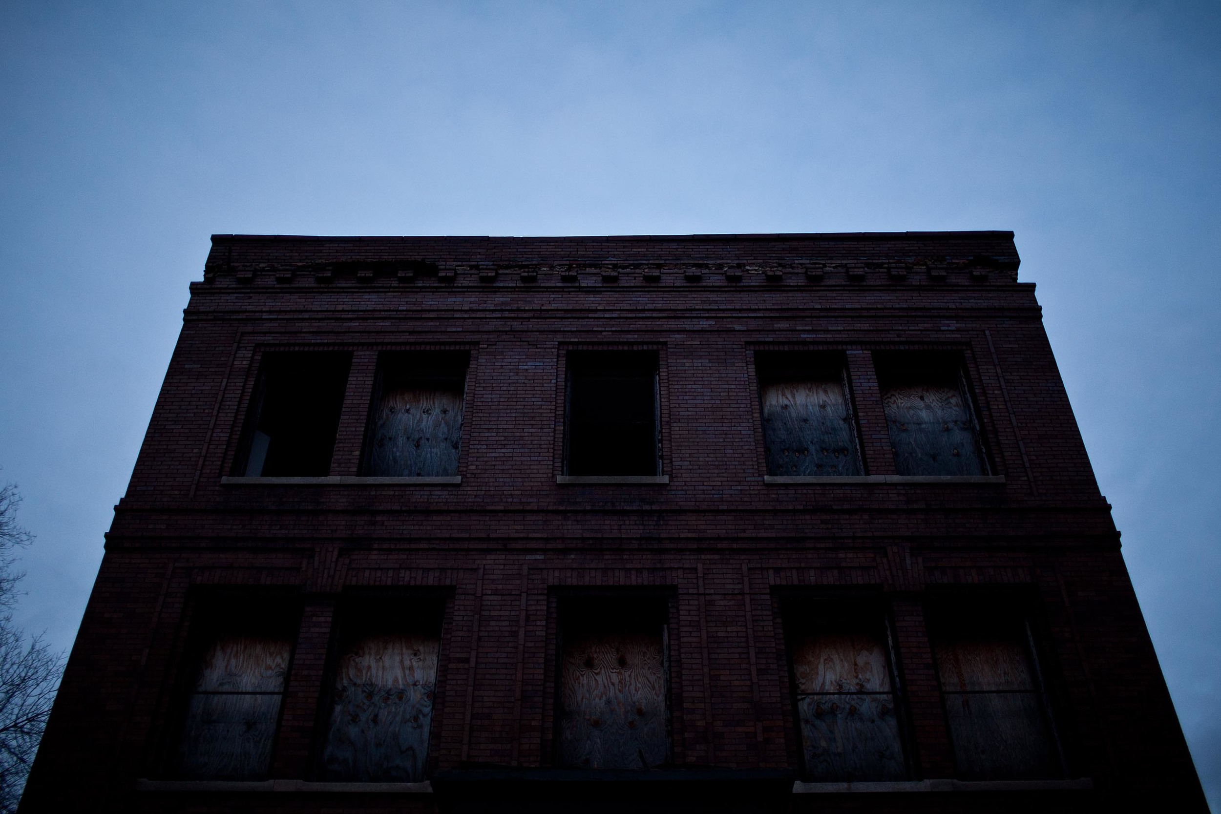  A home sits empty in Chicago’s Englewood neighborhood. Vacant, boarded-up homes and apartment buildings have piled up by the thousands, following the housing market collapse that began with predatory mortgage lending. 