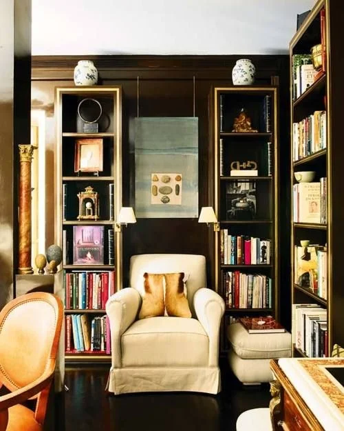 Notice how only one object is used on top of these tall, slender bookcases, kind of like a crown of sorts. It makes them seem taller, kind of like an architectural topper of some kind. Designer: Magdalena Aguilar, via: Nuevo Estilo