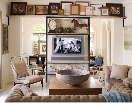 This artwork is stacked all the way across, creating that horizontal banding I mentioned before. Instead of objects, they’re flat pieces of art! Designer: Abby Rizor , via: House Beautiful