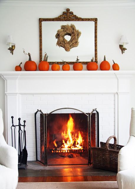 Decorate your mantel using the repetition of an decorative object. | Image source: http://acountryfarmhouse.blogspot.com