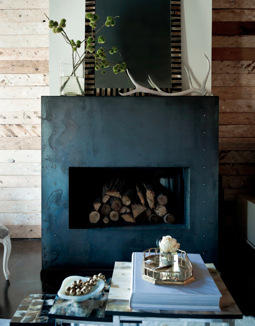 Mantel decorated with branches. | Interior Designer: Jamie Laubhan-Oliver