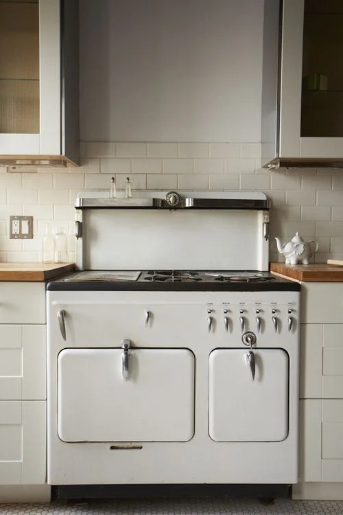 Kitchen; white appliance; stove; oven; range | Located at: Hudson Milliner Bed and Breakfast