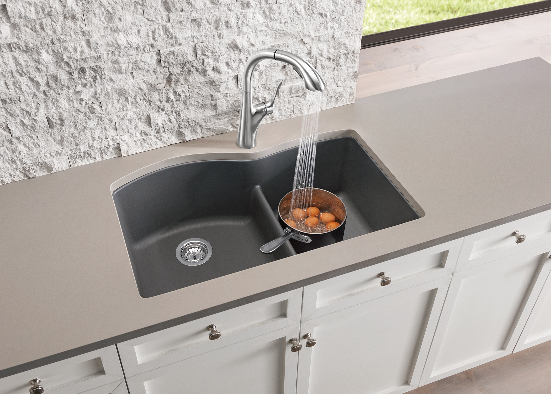 This low divide sink from Blanco has the capacity of a single bowl sink (for large pots and skillets with handles), with a perfect divide that keeps your dirty dishes out of the way while cooking!