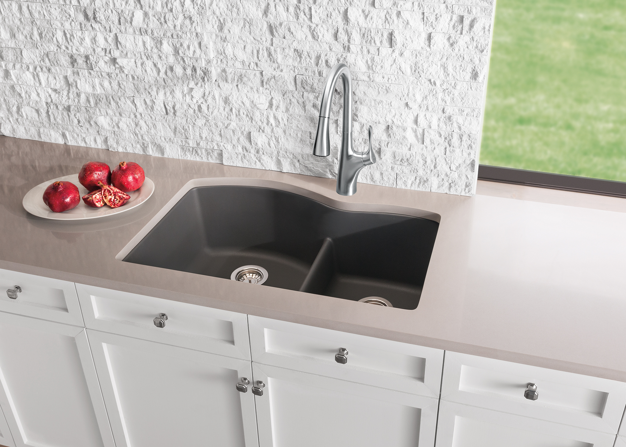 This low divide sink from Blanco has the capacity of a single bowl sink (for large pots and skillets with handles), with a perfect divide that keeps your dirty dishes out of the way while cooking!