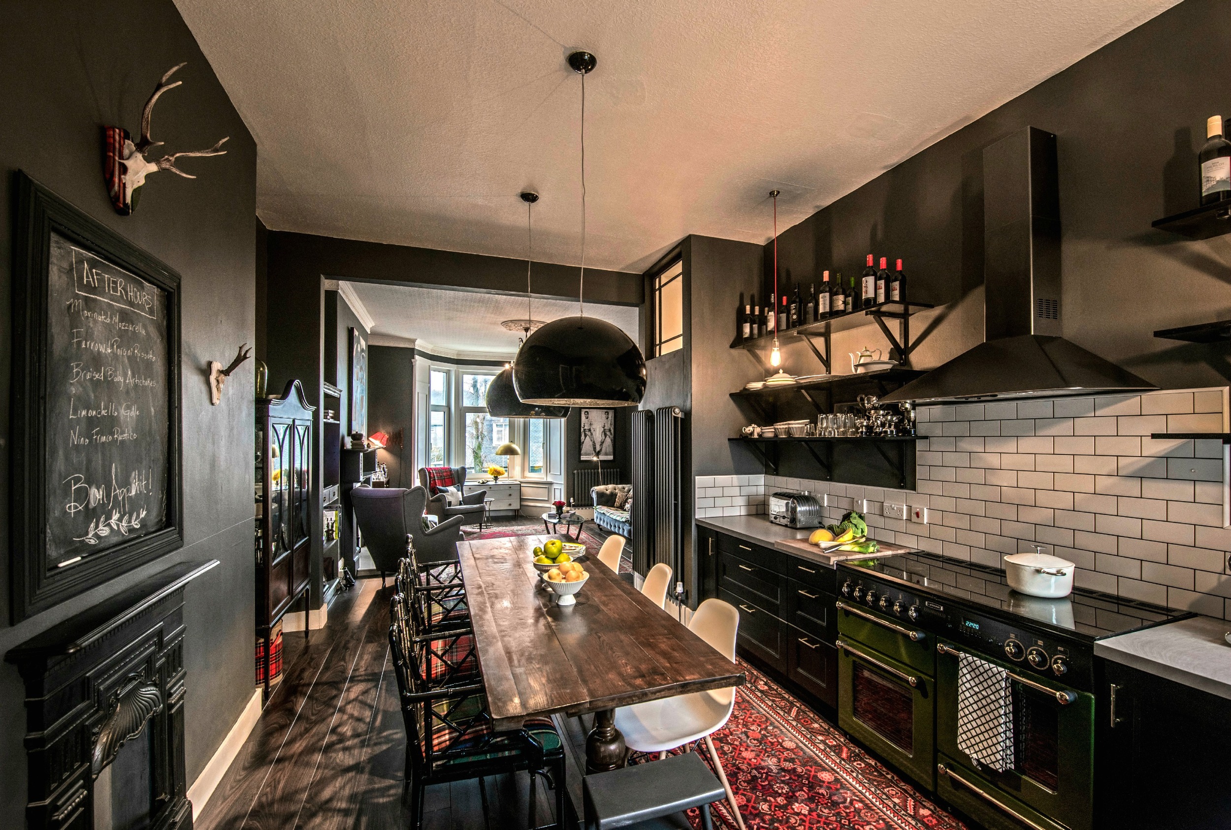 kitchen remodel; lighting; backsplash; chair; wood table; decor; chalkboard; sink | Apartment remodeled by: Deborah Peterson Milne