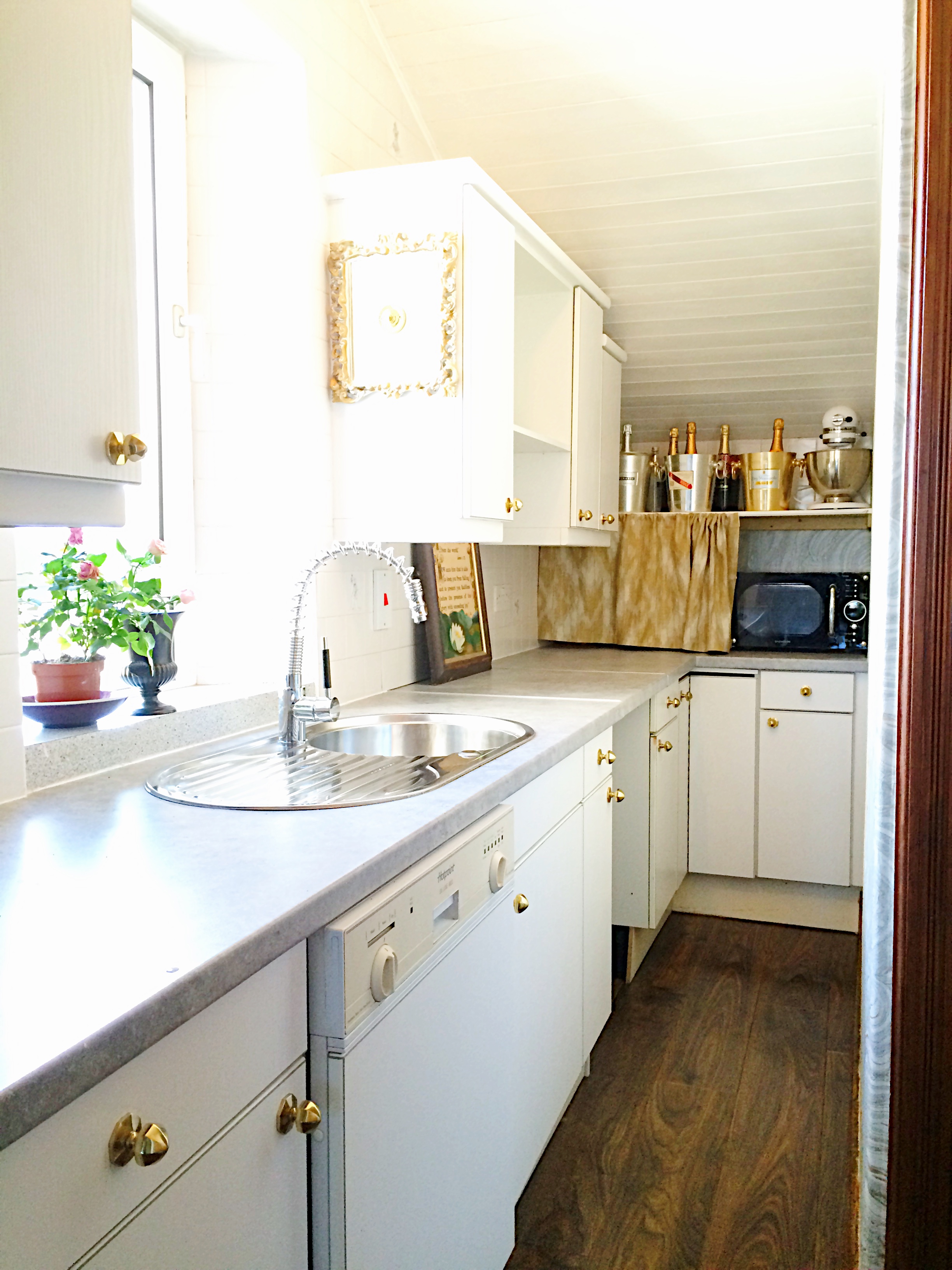 white laundry / utility room remodel; sink; cabinetry