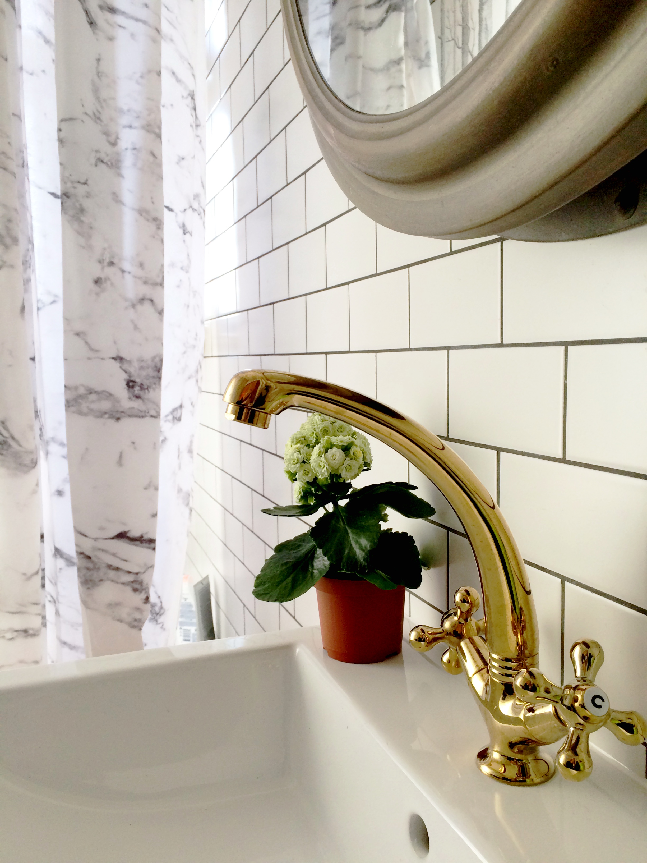 bathroom remodel; mirror; toilet; tile floor; shower; lighting; sink; wall art | Apartment remodeled by: Deborah Peterson Milne