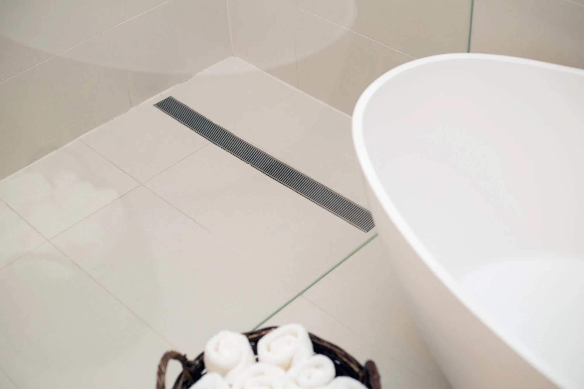 Master bathroom remodel; linear drain; bathtub | Interior Designer: Carla Aston / Photographer: Tori Aston