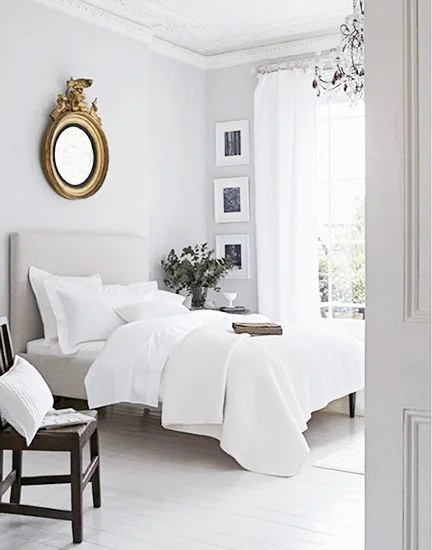 White bedroom; bed; bedding; mirror; chair | Stylist: Elkie Brown / Image source: Domaine Home