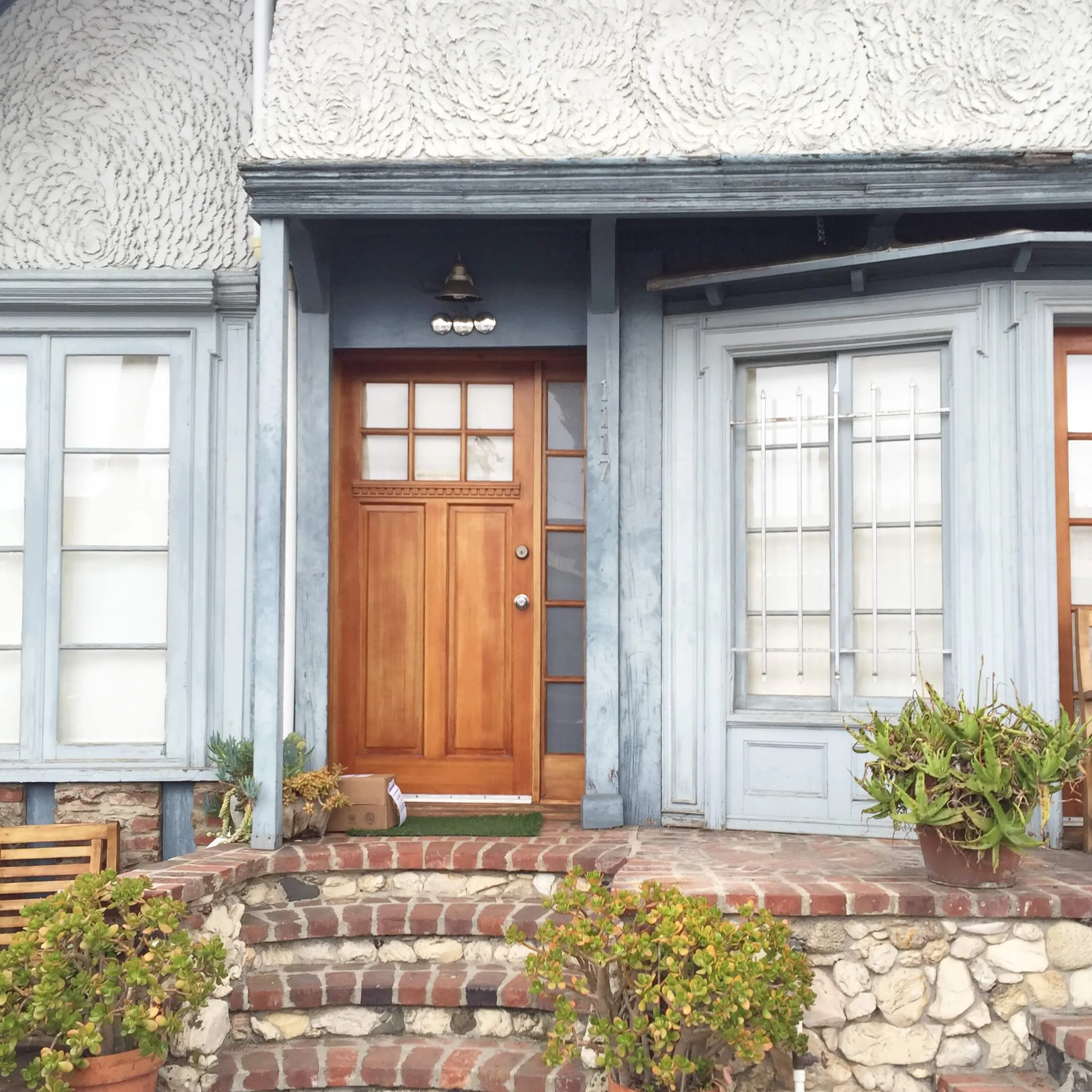 Slate gray and warm wood tone at entry