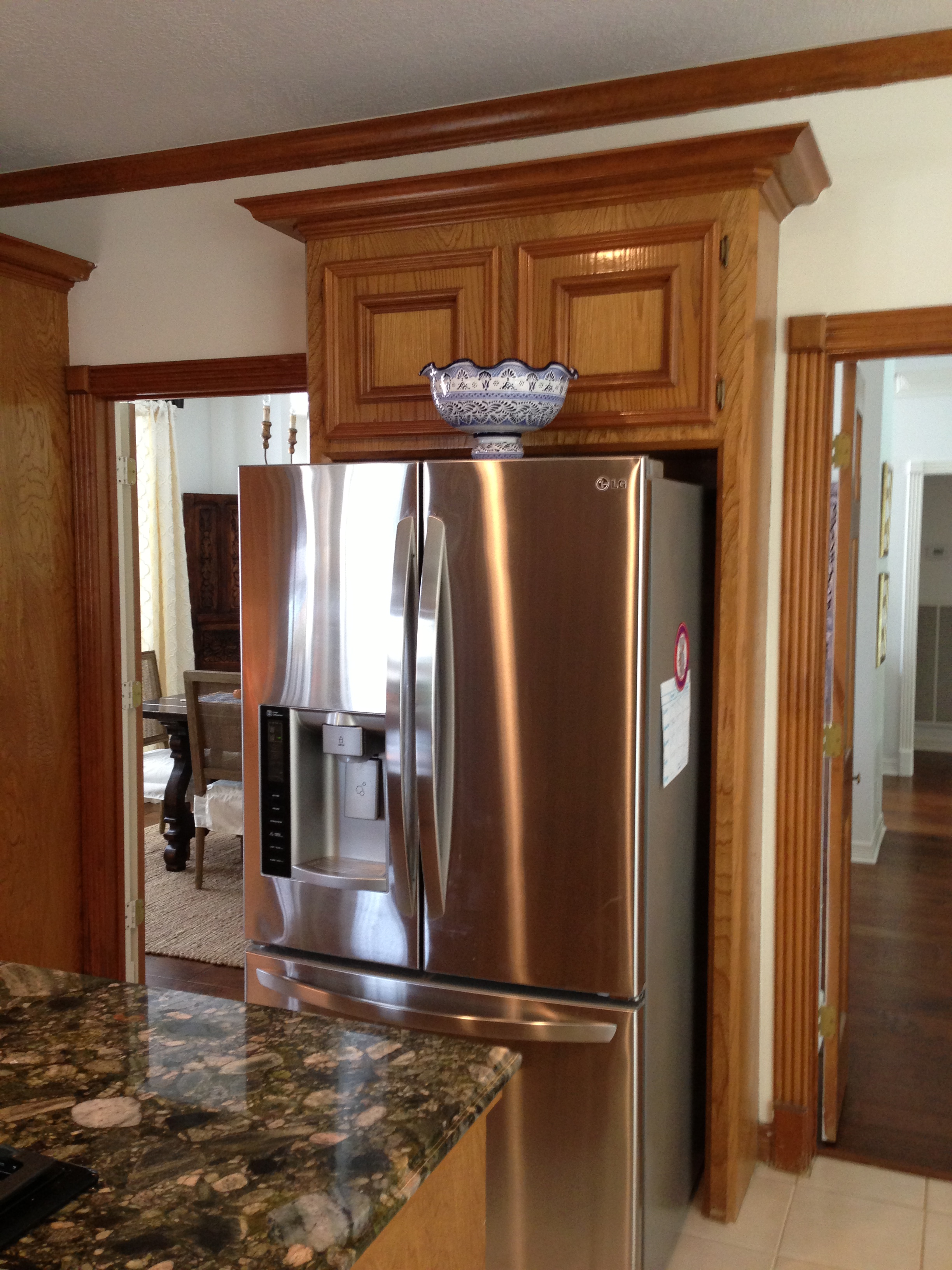 Useless cabinet above frig