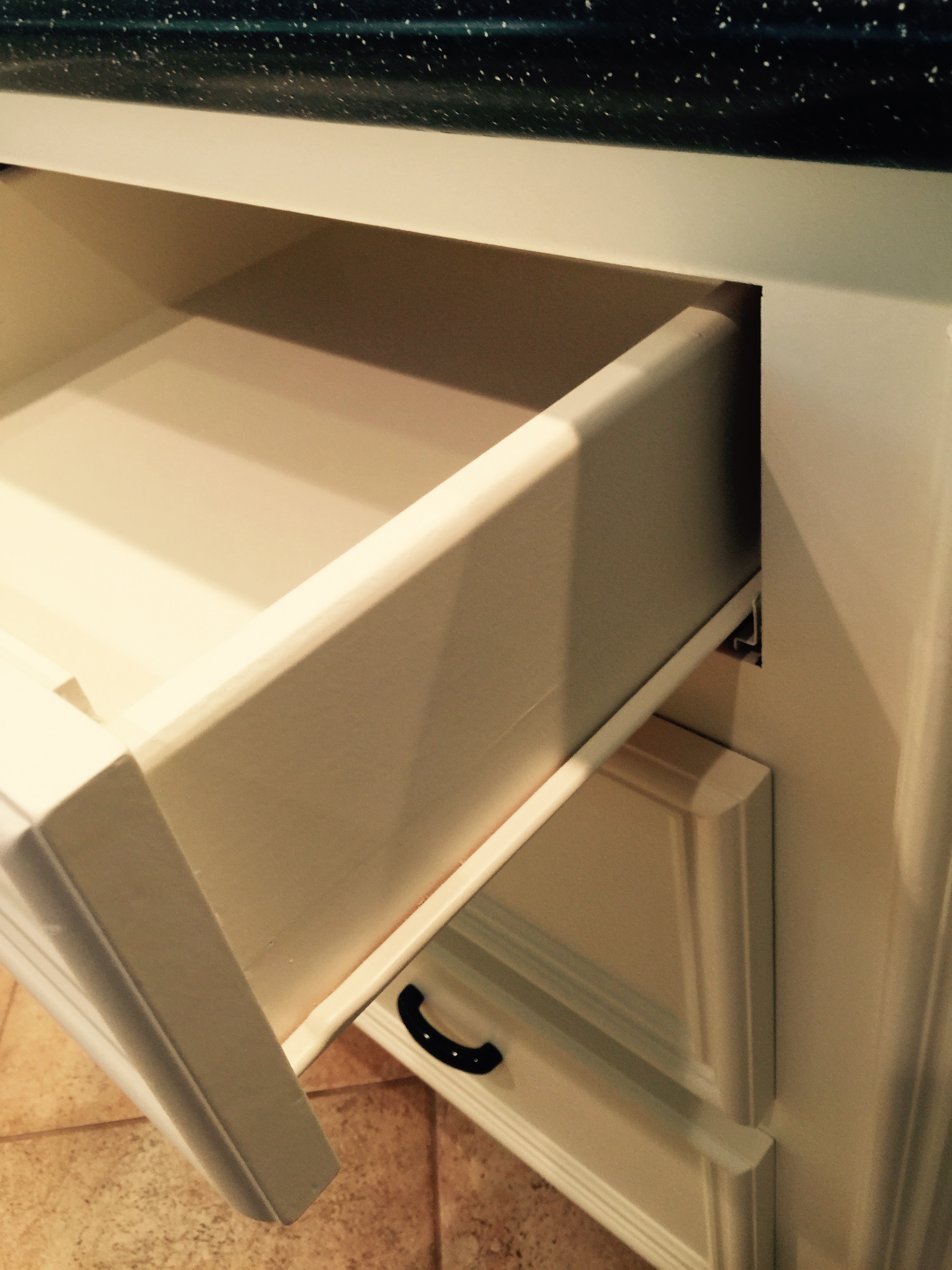 Standard drawer glides found in many builder homes.