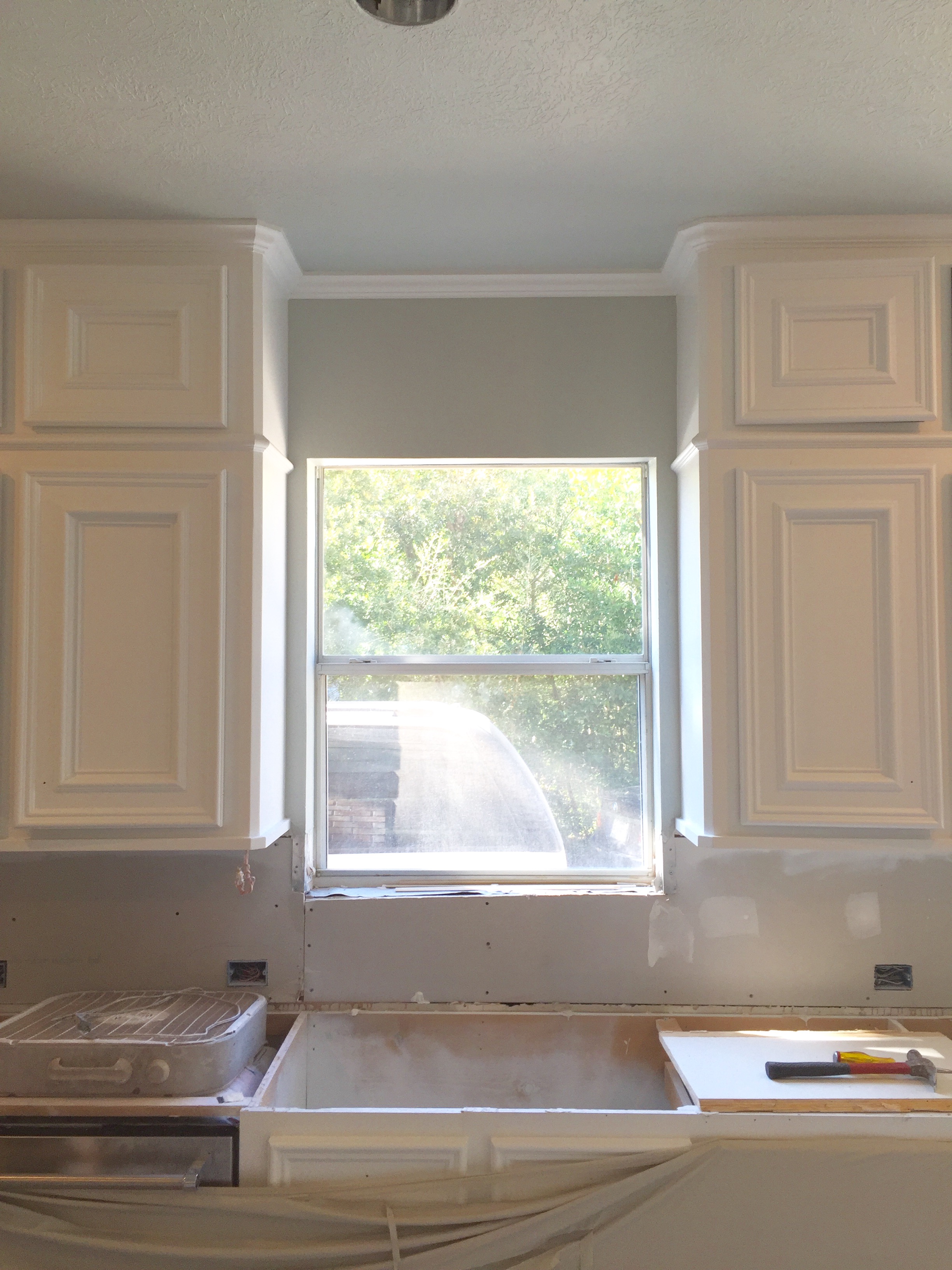 Progress shot - cabinetry now goes to ceiling and furr down has been removed. Cabinets have been painted and new hinges were used.