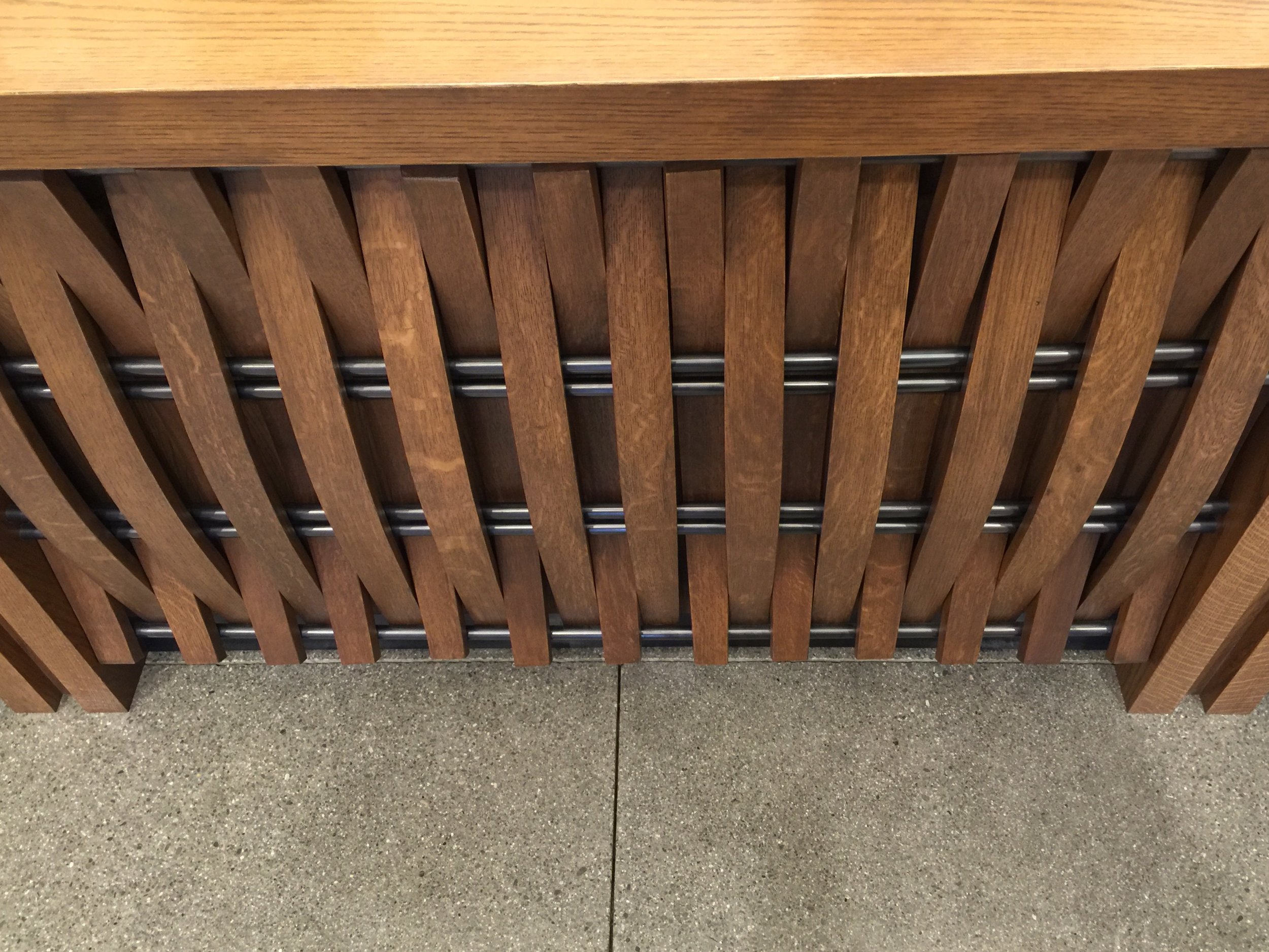 Wine barrels were used to create the front panels of the reception desk at Joseph Phelps Vineyards.