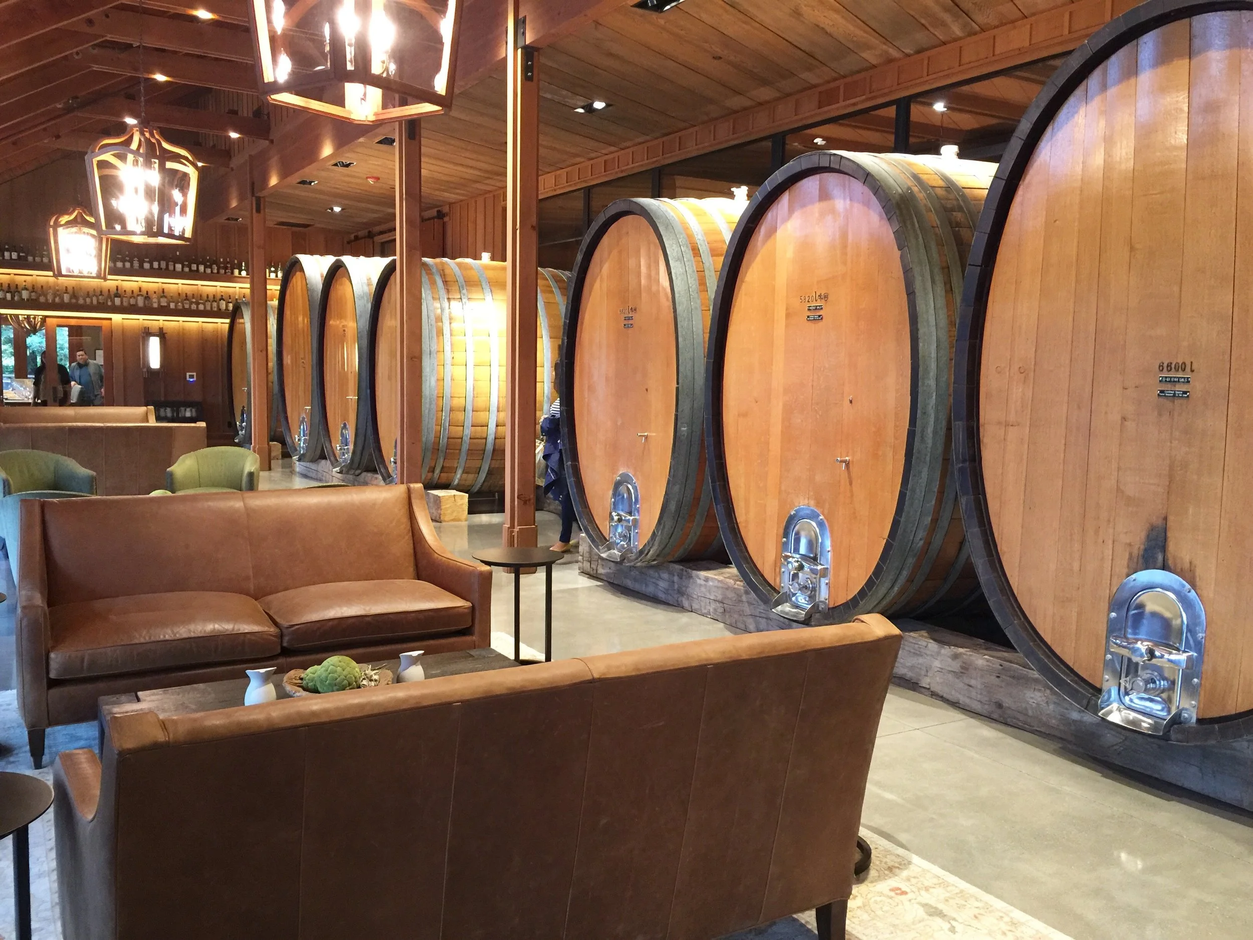 The Oval Room houses huge casks of wine with leather seating and more wood finishes.