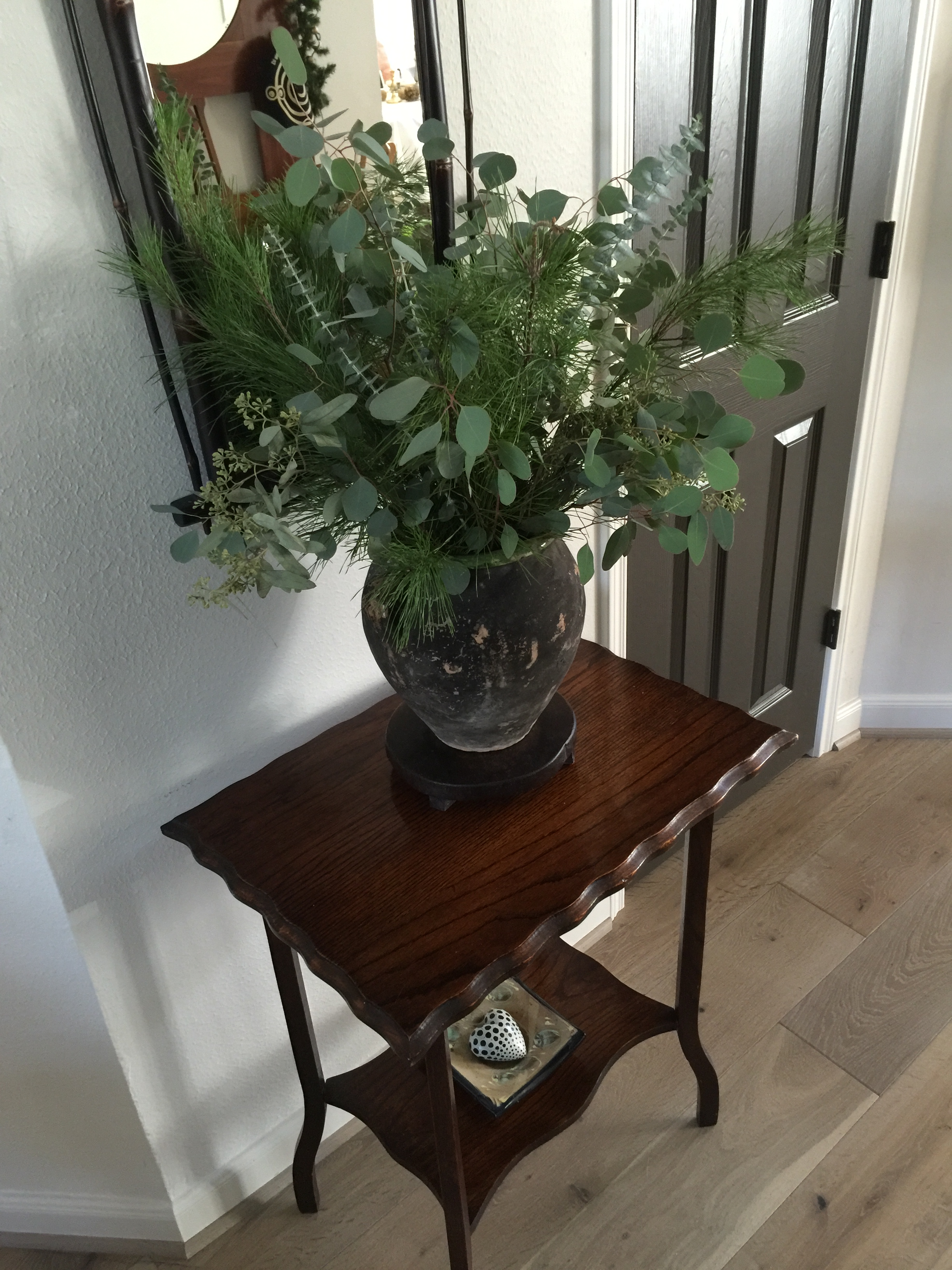 Fresh greens in antique olive jar