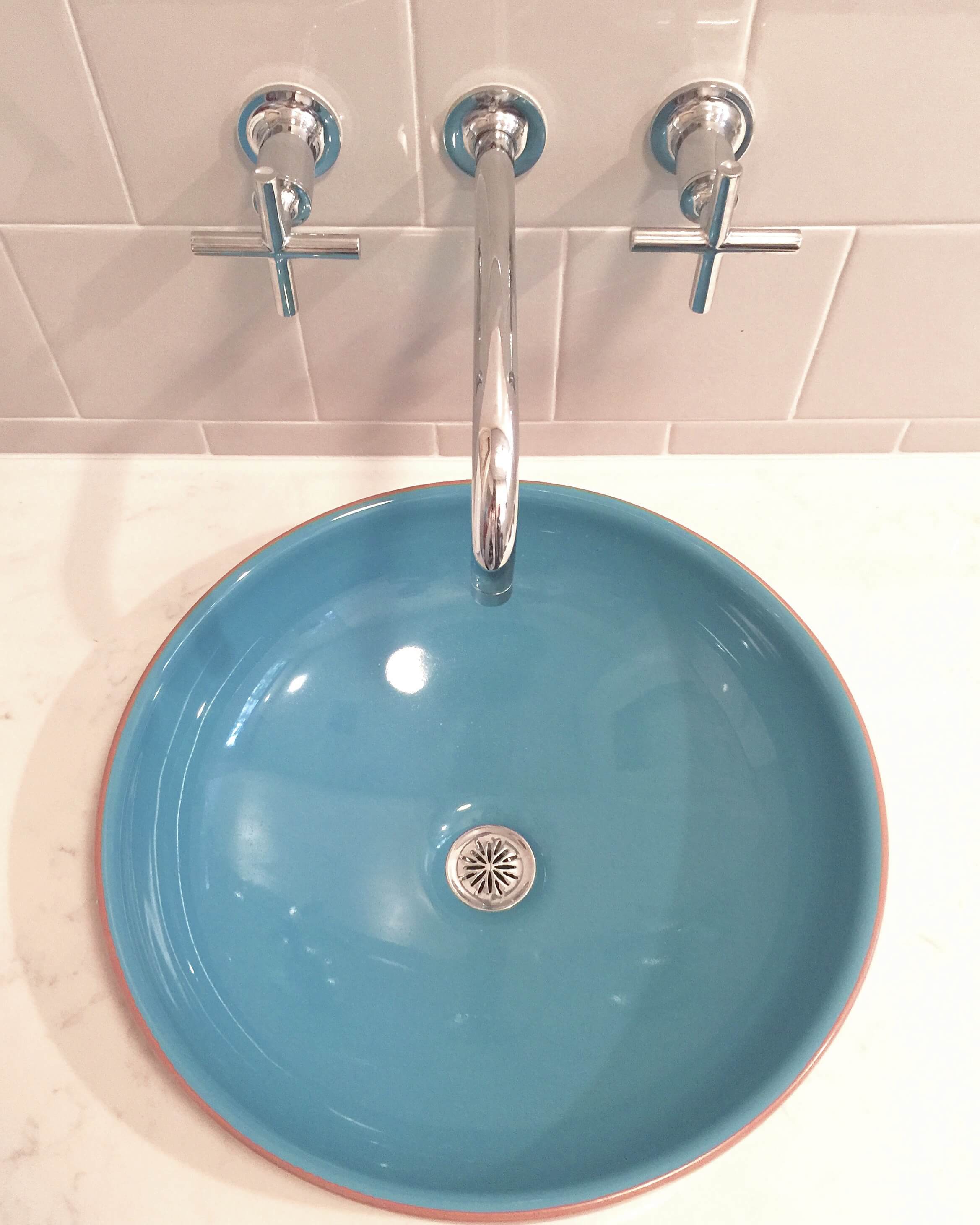 Turquoise vessel sink with Kohler Purist wall mount faucet