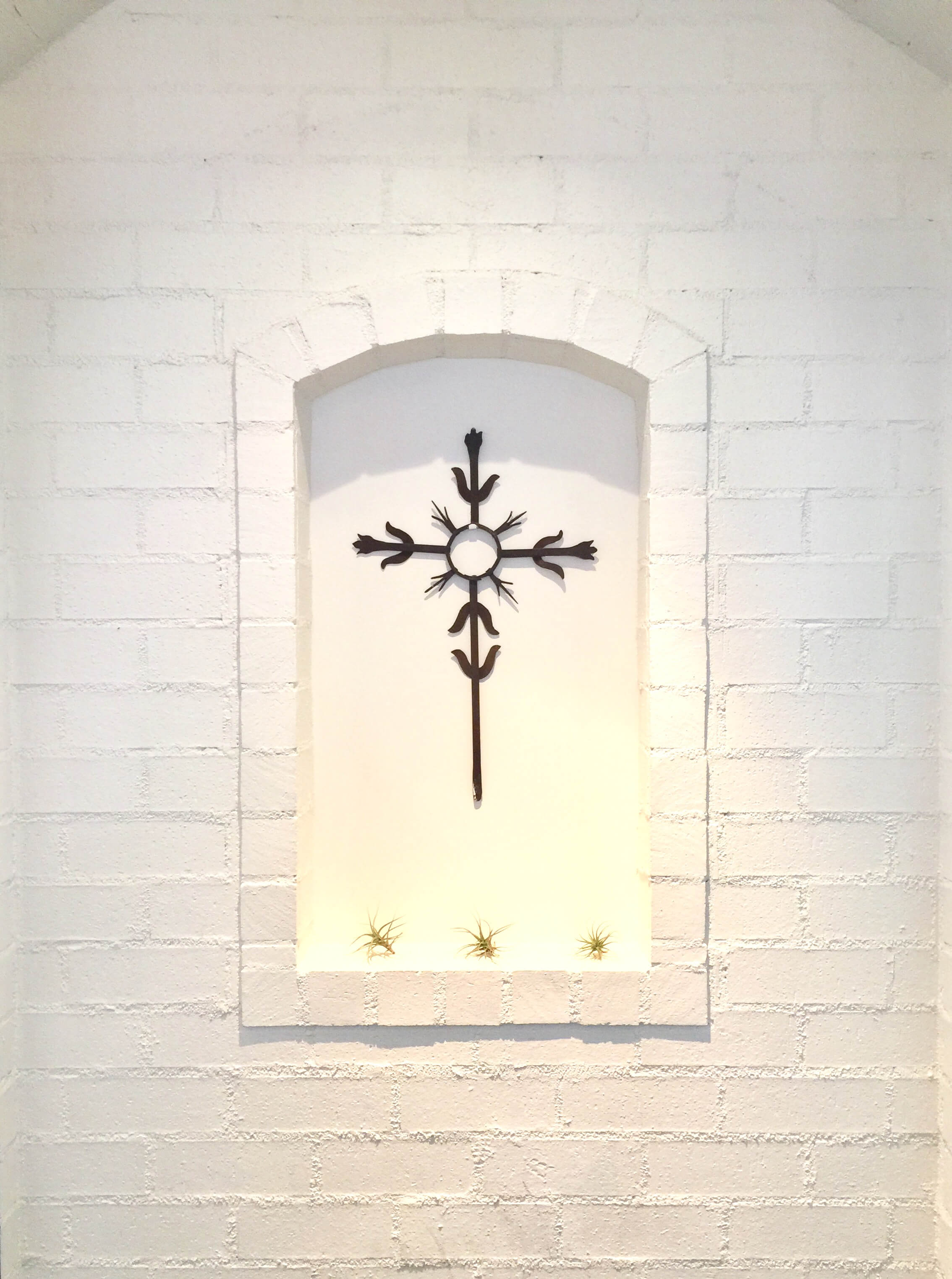 Wall niche decorated simply with painted white brick