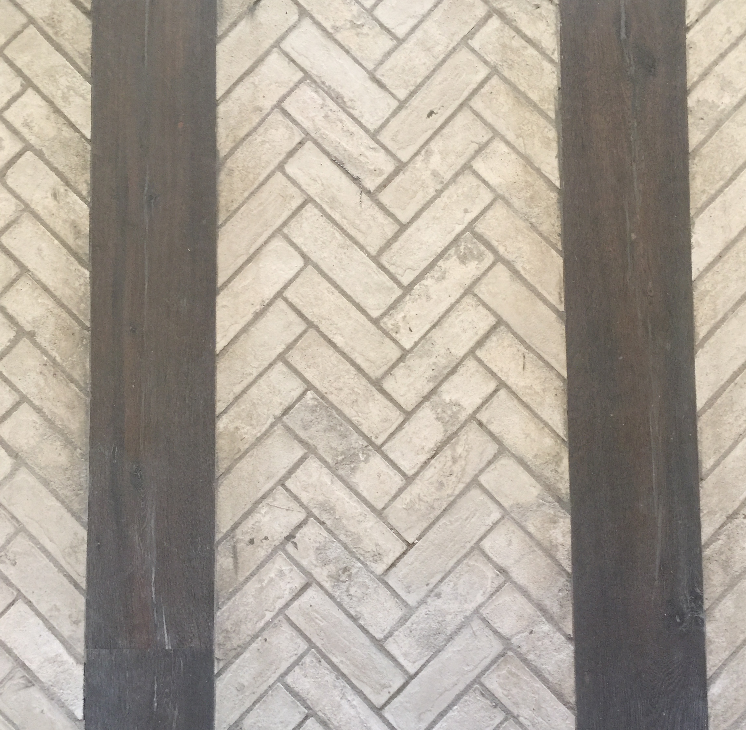 Herringbone brick floor with rustic wood in Entry Hall - Designer Teena Caldwell