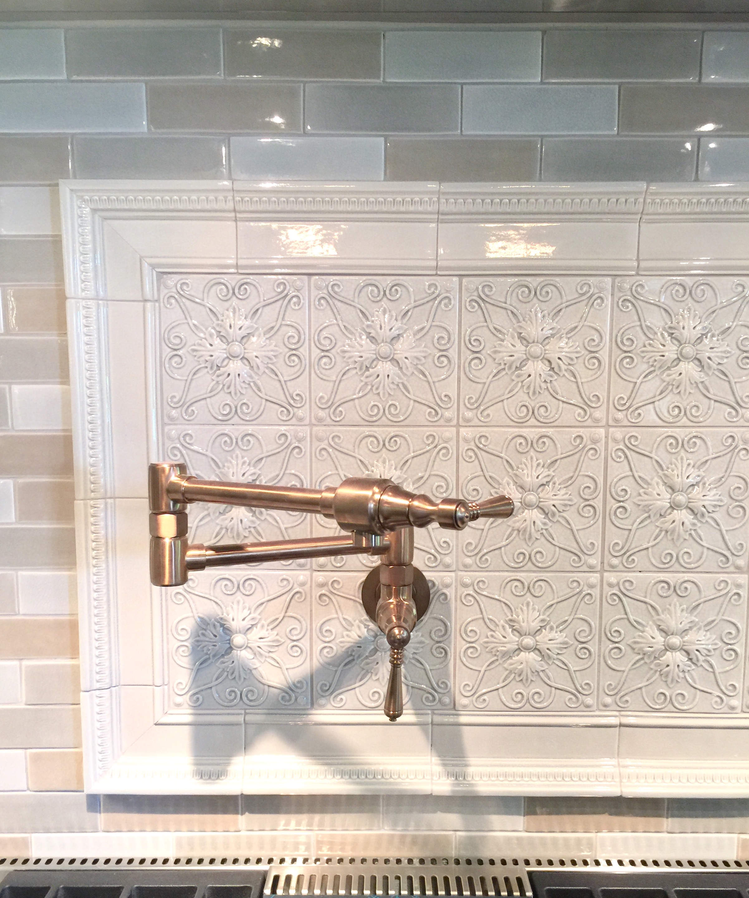 Intricate tile backsplash with potfiller and tile from Walker Zanger - Designer Donna Jarnigan
