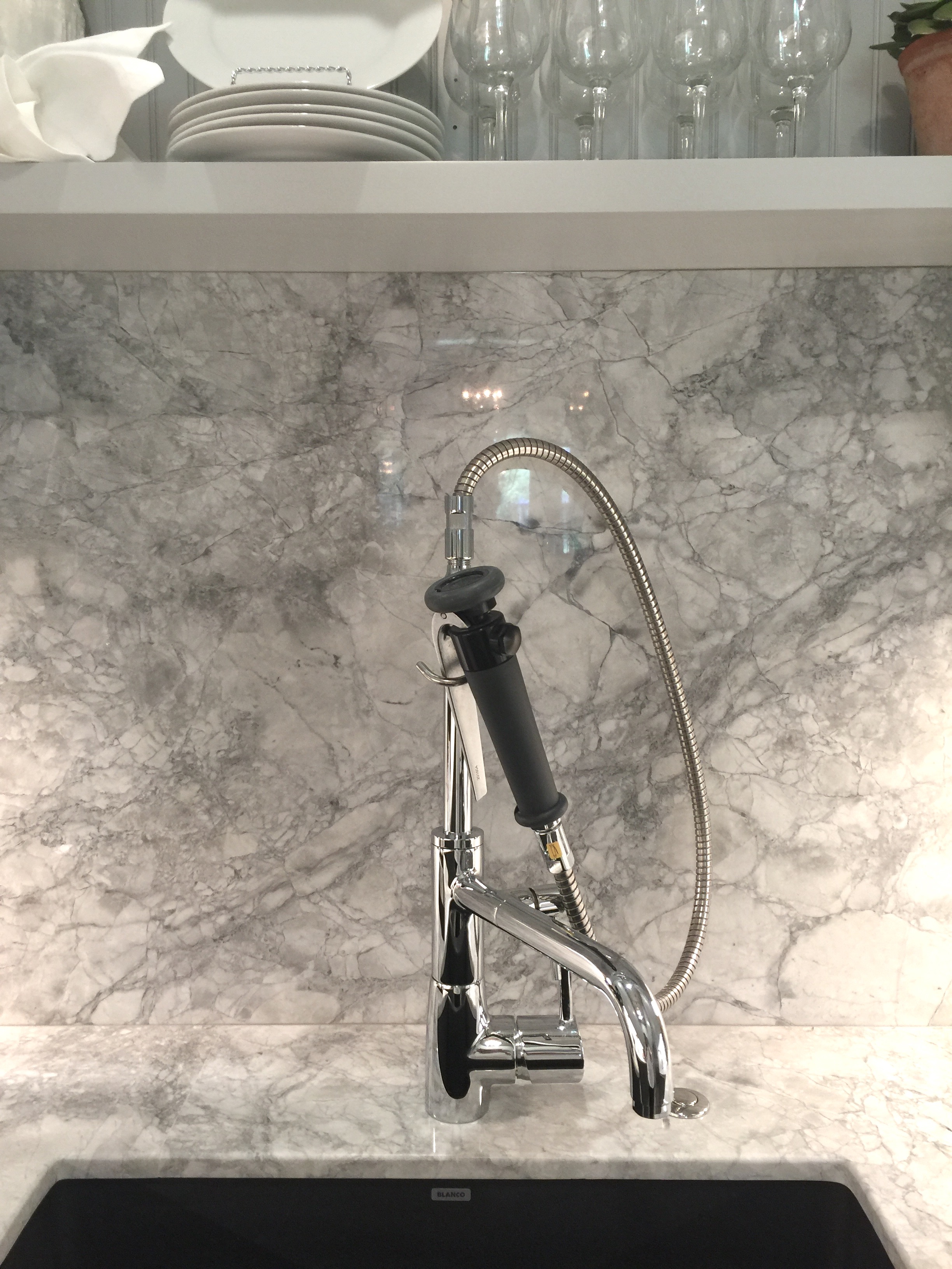 Marble counter and backsplash with unique faucet in butler's pantry - Designer Jamie Haskins