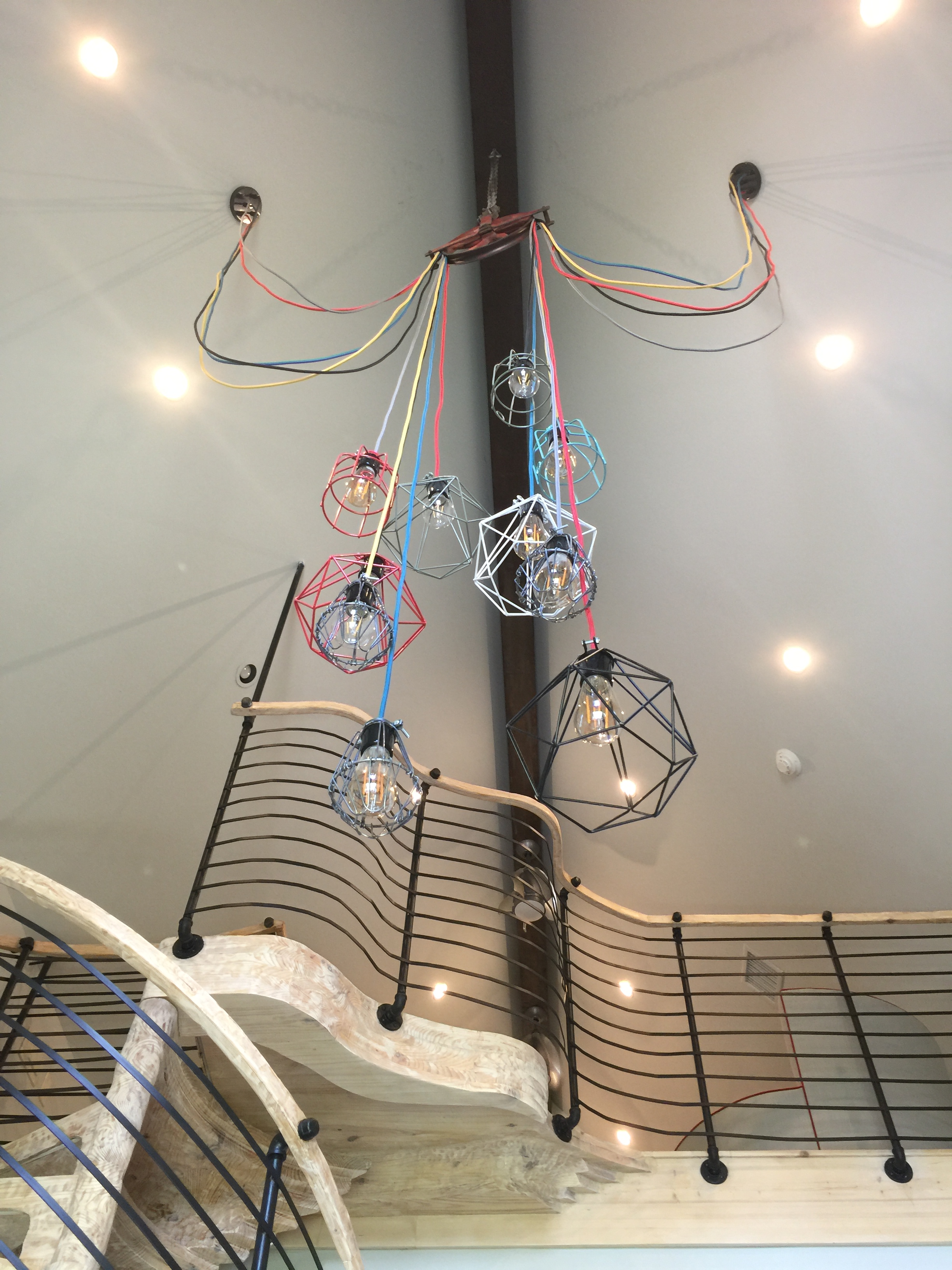 Fun industrial light fixture with play loft in boy's bedroom - Designer Shundra Harris