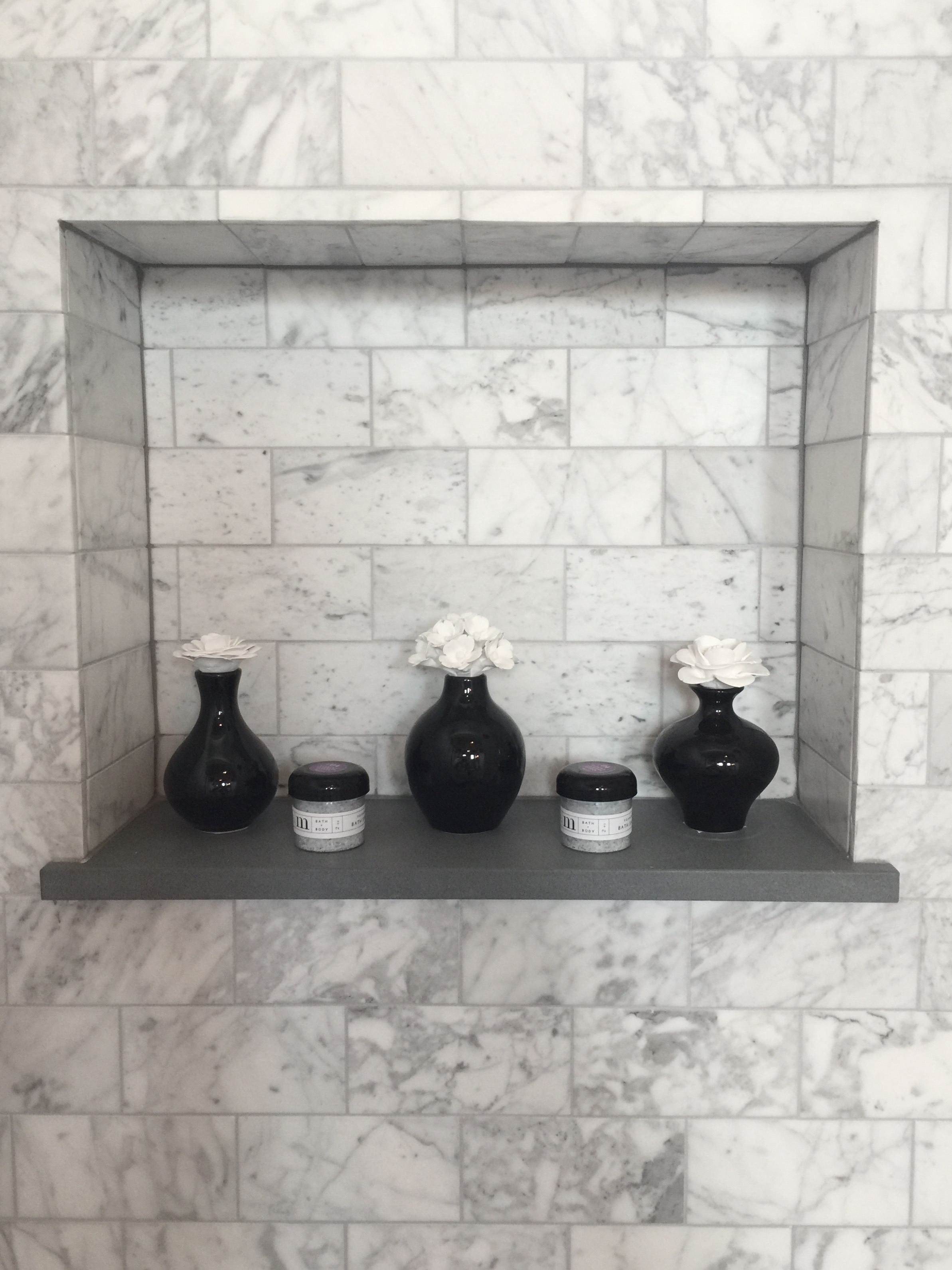 Shampoo niche details in the bathroom designed by Desiree Engram