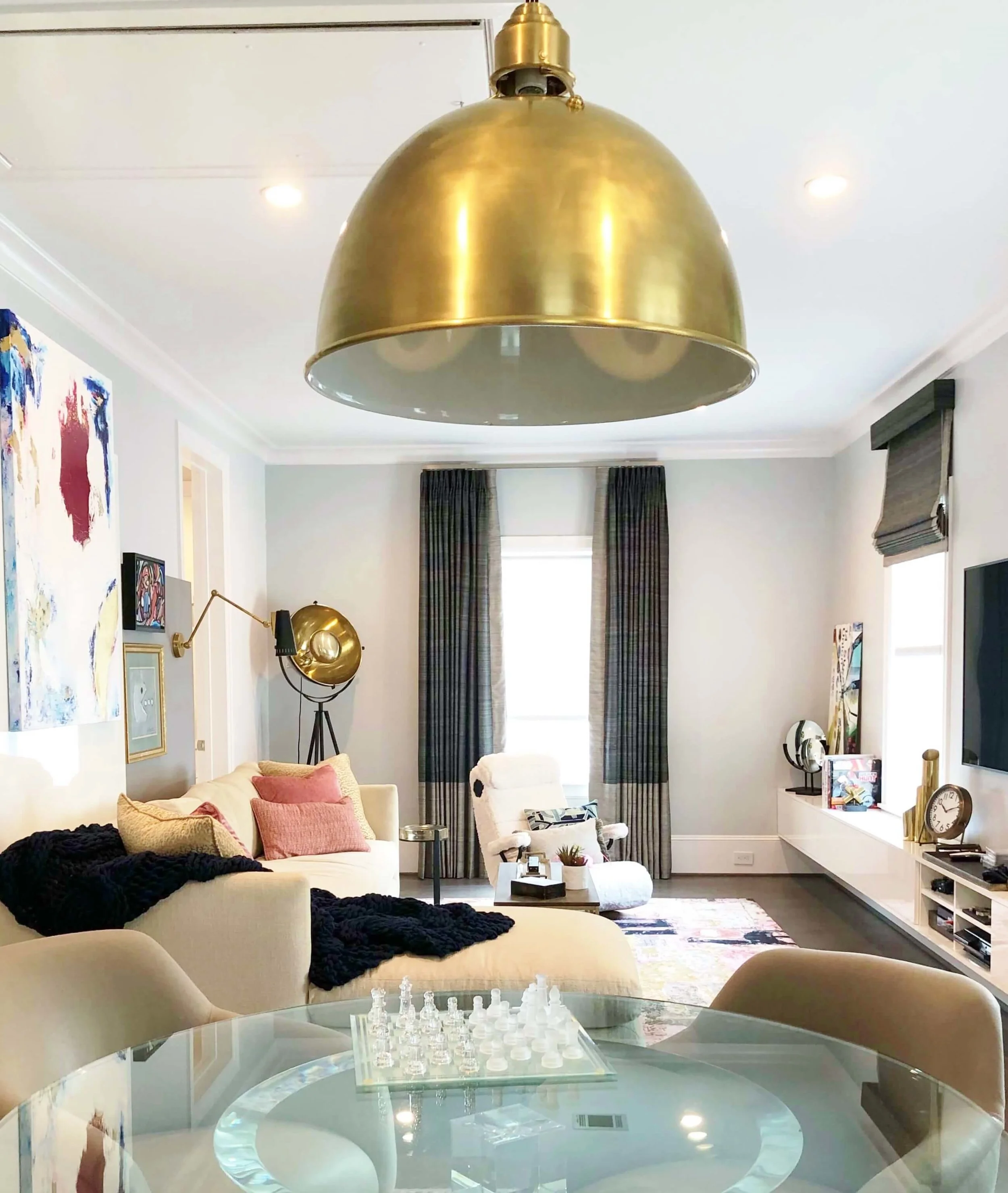 Fun gameroom designed by Cristina Robinson, with a gaming chair, sectional sofa, and game table. | ASID River Oaks Showhouse #gameroom #gameroomideas