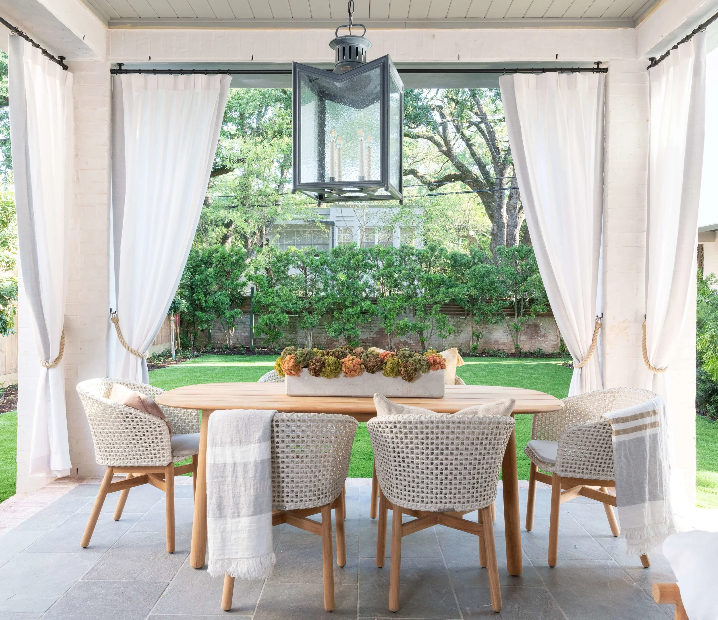 The outdoor living space, designed by Roxanne Wimmel of Wimmel Design + Construction, extended the living area of this ASID River Oaks Showhouse and made for a great place to entertain. Photographer - Michael Hunter #outdoorliving #outdoordining