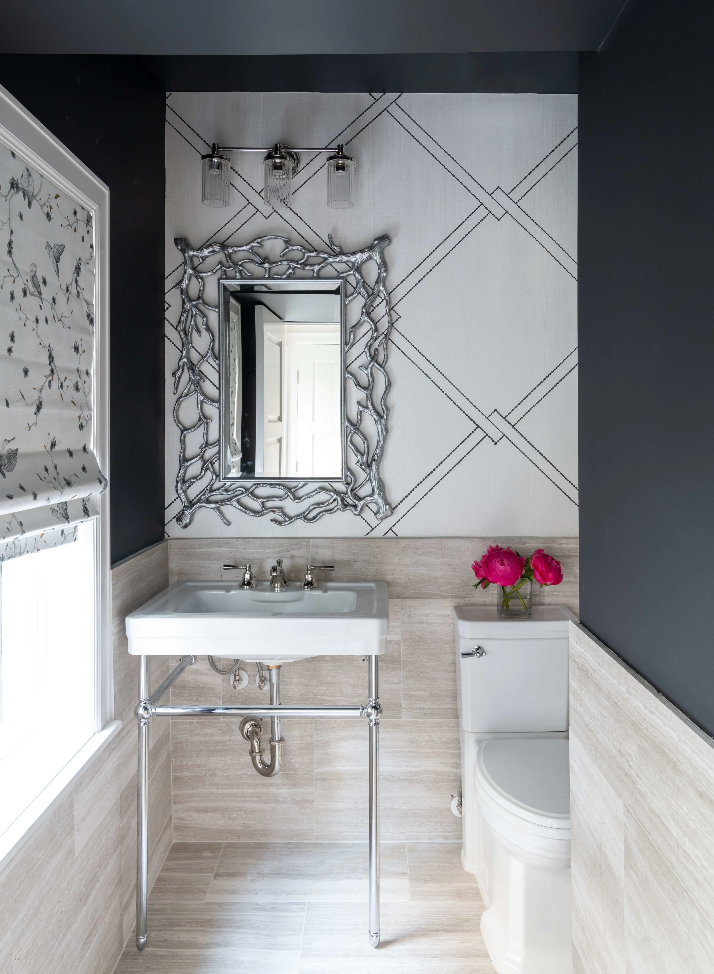 This pretty downstairs powder room with bold black walls and a graphic wall pattern was designed by Lauren Ashley of LA Designer Affair. | ASID River Oaks Showhouse, Photographer - Michael Hunter #powderroom #powderbath