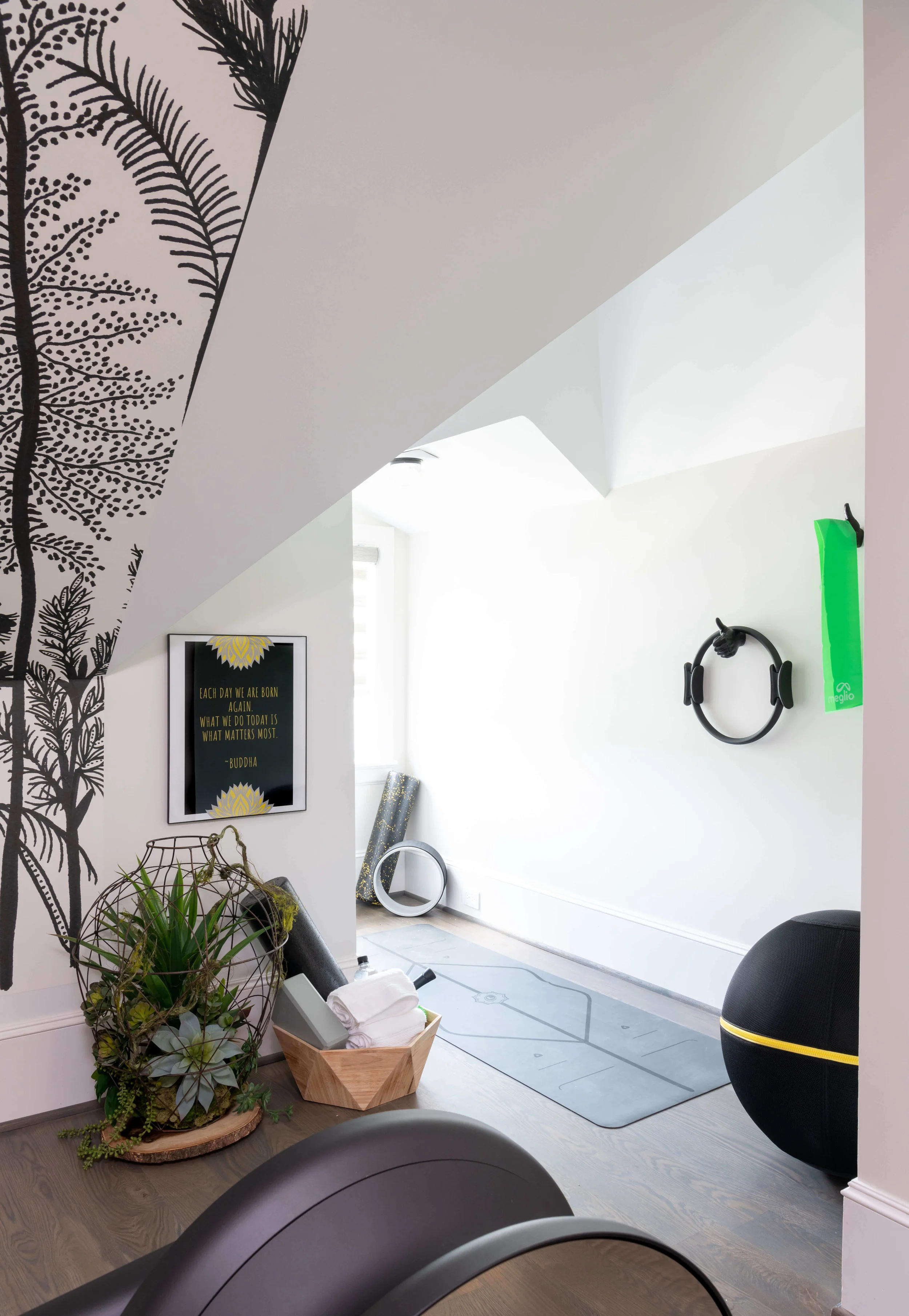 The exercise room on the 3rd floor of this home takes advantage of the open space with an energizing mural and exercise equipment. Designed by Saima Seyar, Elima Designs | ASID River Oaks Showhouse, Photographer - Michael Hunter #exerciseroom #workoutroom