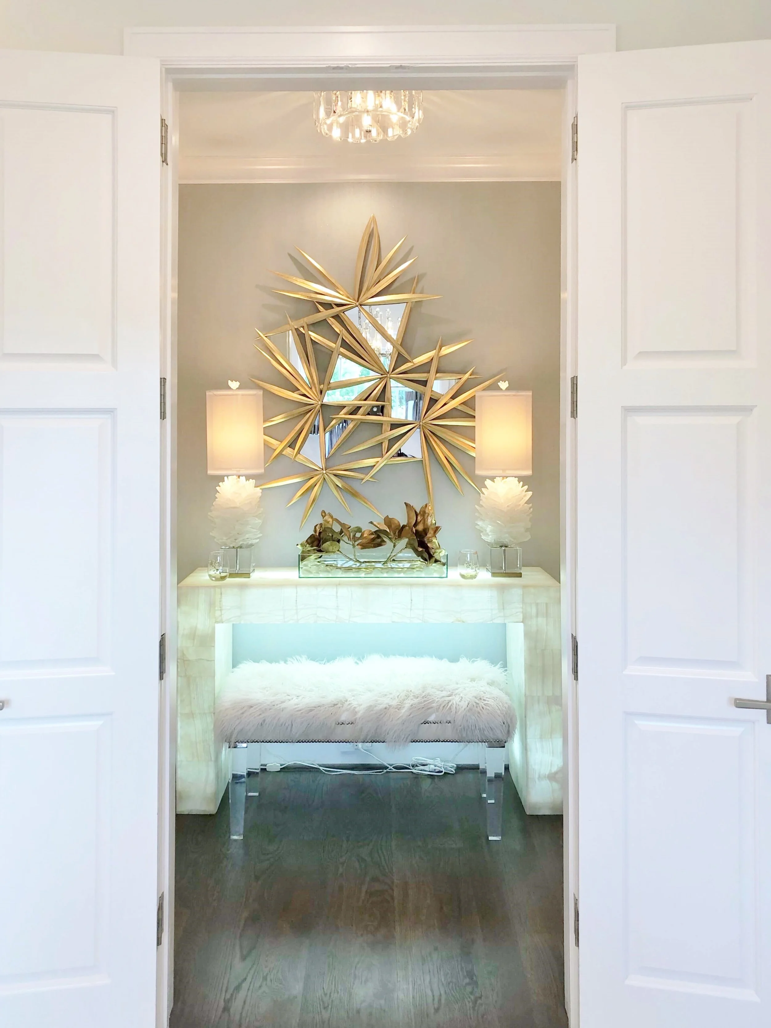 Gilded touches, faux fur and selenite add some glam to the master bedroom foyer, designed by Teena Caldwell of Twenty-Two Fifty Interiors. | ASID River Oaks Showhouse #masterbedroom #bedroomdesign #console