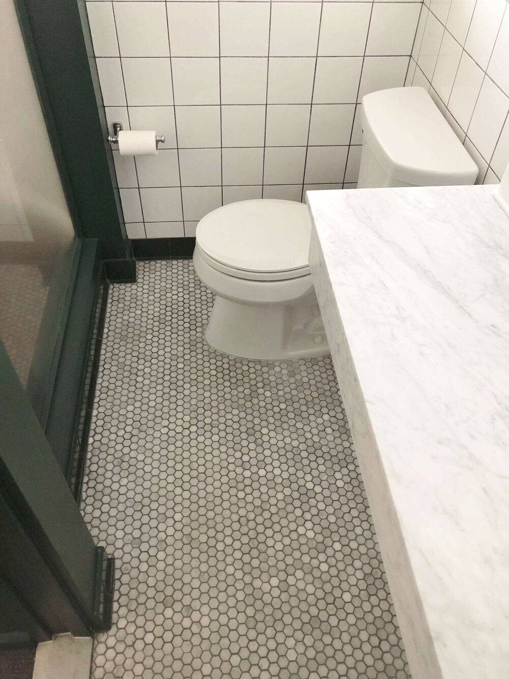 Small Bathroom Design Tips - Check out the distance between the counter and door frame and then the toilet and glass wall, in this hotel bathroom.