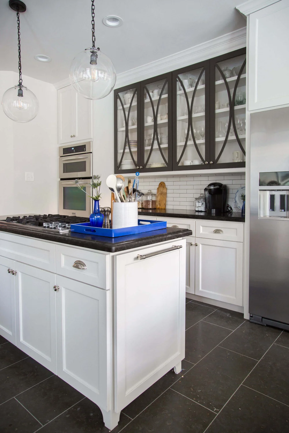 High contrast details on the cabinetry, in my white kitchen, adds interest and creates a striking backdrop. Designer, Carla Aston | Photographer, Tori Aston #whitekitchen