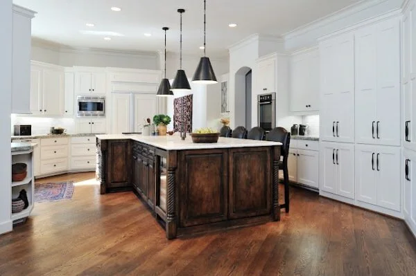 This dark stained island with turned legs stands out in the white kitchen. Designer, Carla Aston | Photographer Miro Dvorscak #whitekitchen