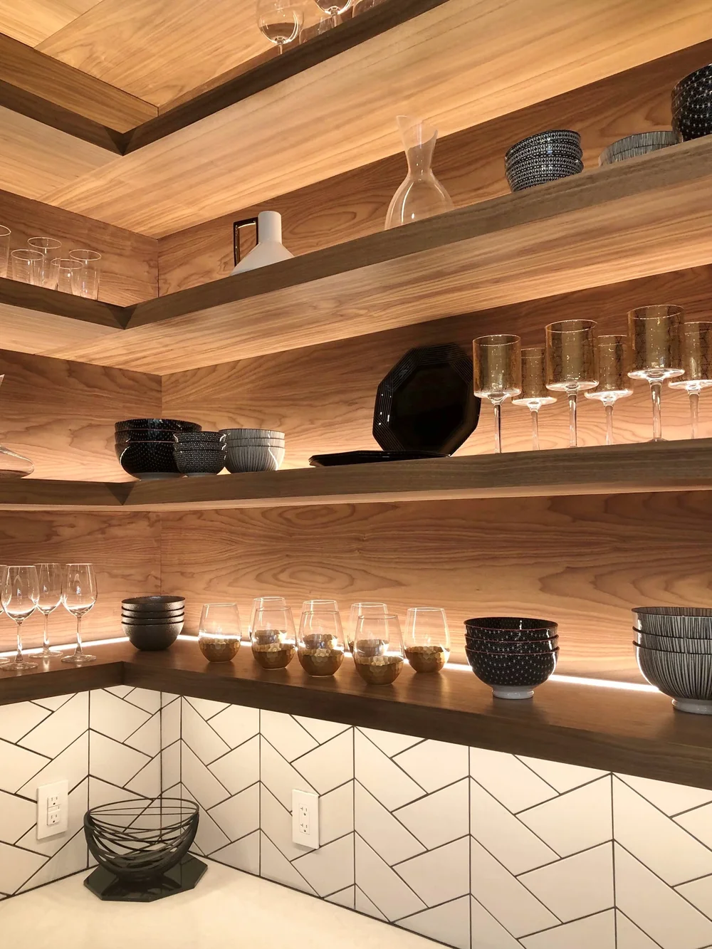 Warm wood shelves wrap the corner of this modern kitchen | The New American Remodel TNAR | #remodeling #remodel #kitchenideas #kitchendesign