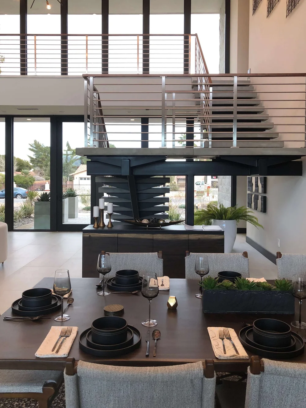 This view is looking back on the dramatic stair and entry, from the dining table. The New American Remodel TNAR | #remodeling #remodel #contemporarystair
