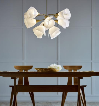 The organic shape of the Mobius 12 light pendant, from Hubbardton Forge gives a nod to biophilic design.