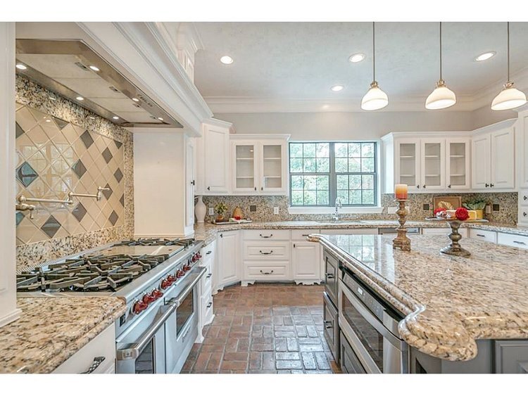 BEFORE - This kitchen needed an update to be rid of the spotty granite. How can we do this without doing ALL of it at once?