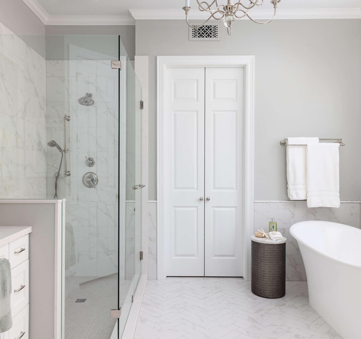 We straightened those angles out and opened things up in this light and bright remodel. Swipe for the before. #designedcarlaaston After photo by @collscottphoto #bathroomremodel #thewoodlandstx #designhouston #bathroomdesign #bhghome #sundayvibes #de