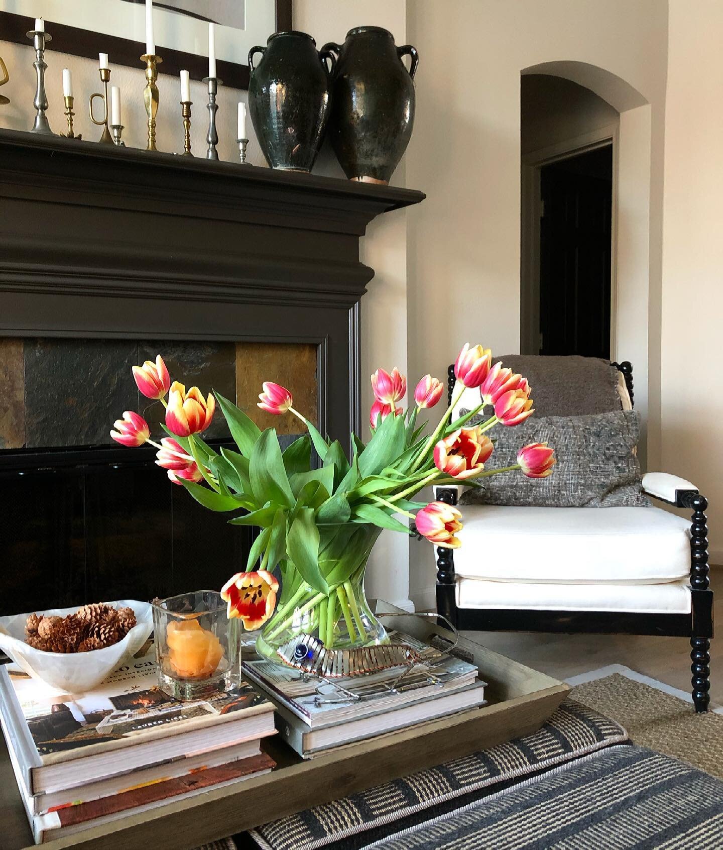 Enjoying this sunny weekend with some pretty tulips in my living room. I&rsquo;m ready for spring! #designedcarlaaston #thecollectedlook #tulips #tulipsofinstagram #springdecor #thewoodlandstx #designhouston