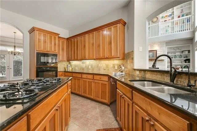 BEFORE  - Kitchen Remodel | The wall between the kitchen and living room came down to open up the space in this kitchen remodel. The space between cooktop and sink was crowded for such a big kitchen.  carlaaston.com