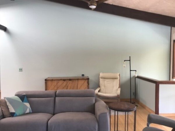 Living room with a big blank wall that needs something. carlaaston.com