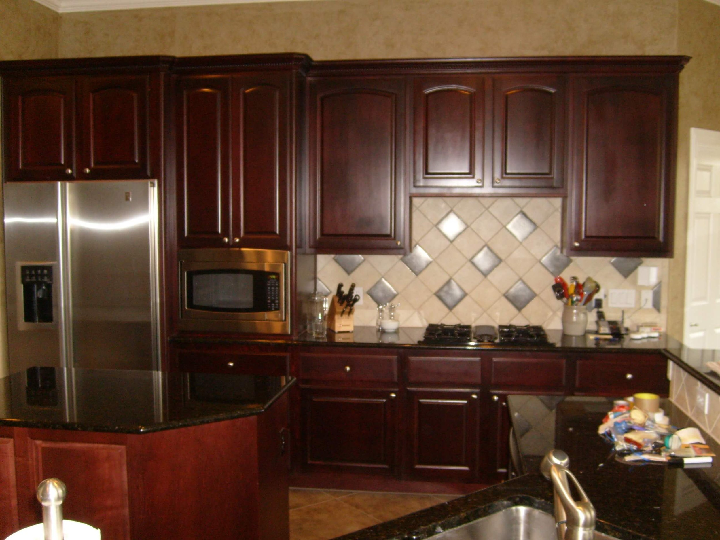 Bold, Small Kitchen with Green Cabinets and Slate Appliances