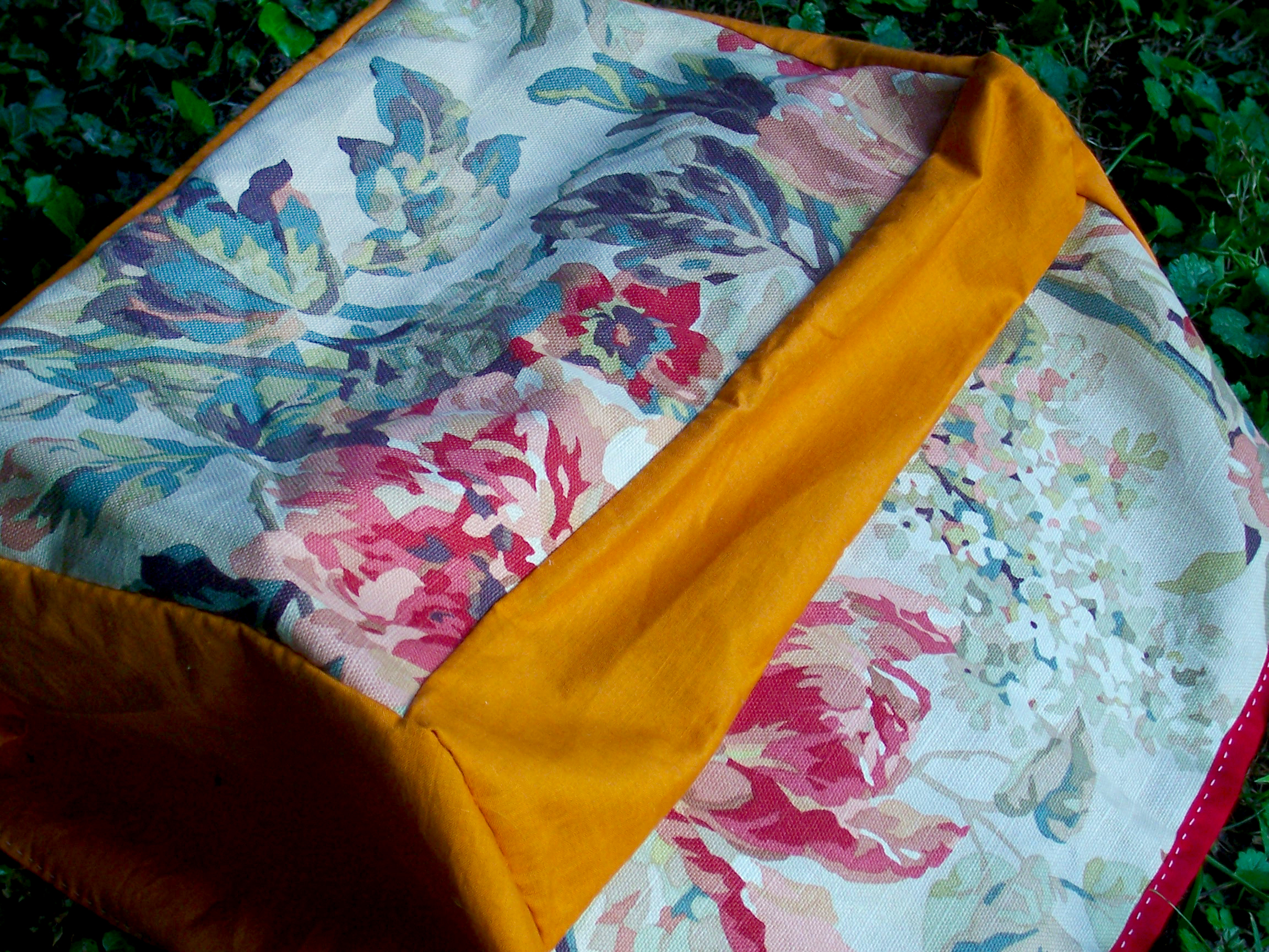 A hand-sewn cover for traditional typewriter sized to fit Lindsay's 1950s Remington Rand manual typewriter. Constructed from fabric and thread found in a flea market.