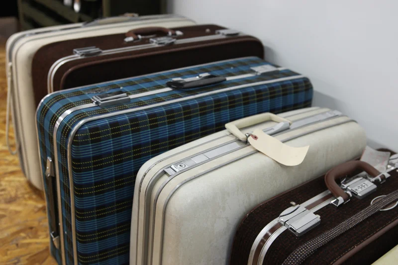 Old suitcases hide workshop supplies.