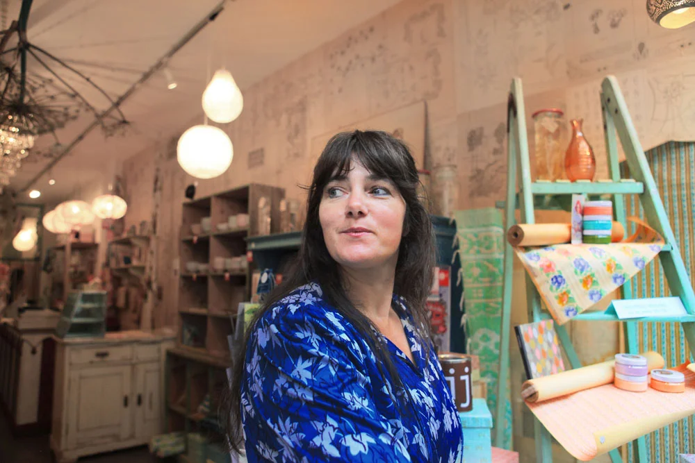 Proprietor Anna looks out towards the hustle and bustle of Haalemmerstraat.